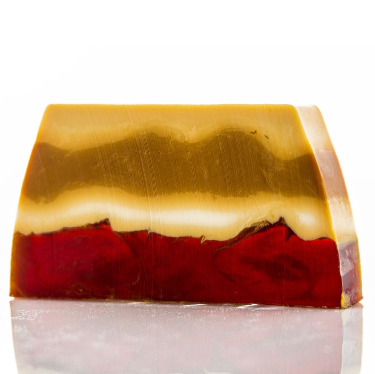 A 100g artisan soap slice featuring warm brown and cream layers, designed to look and smell like a sweet cookie.