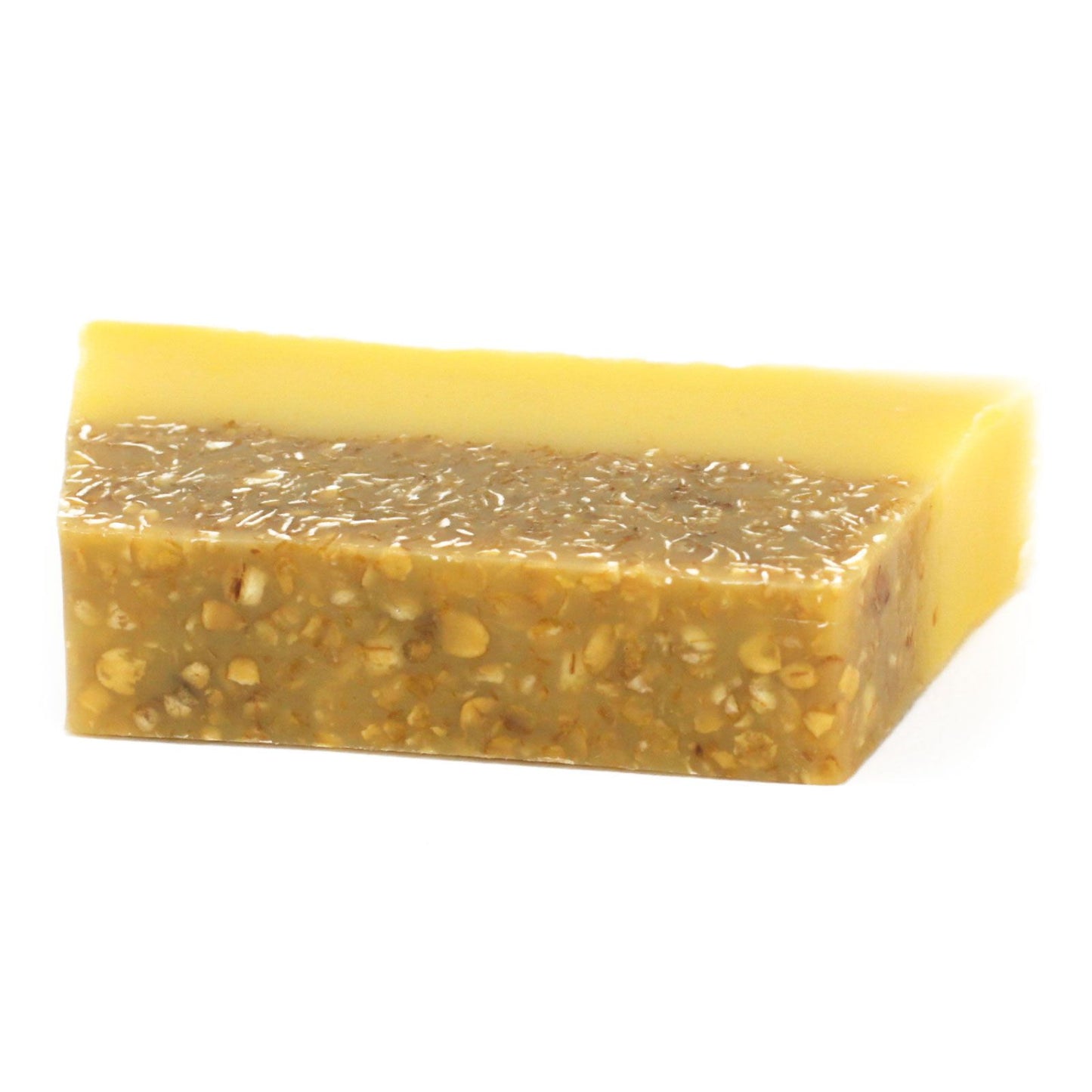 A handcrafted soap slice with a textured yellow top and creamy white base, reminiscent of a tropical smoothie.