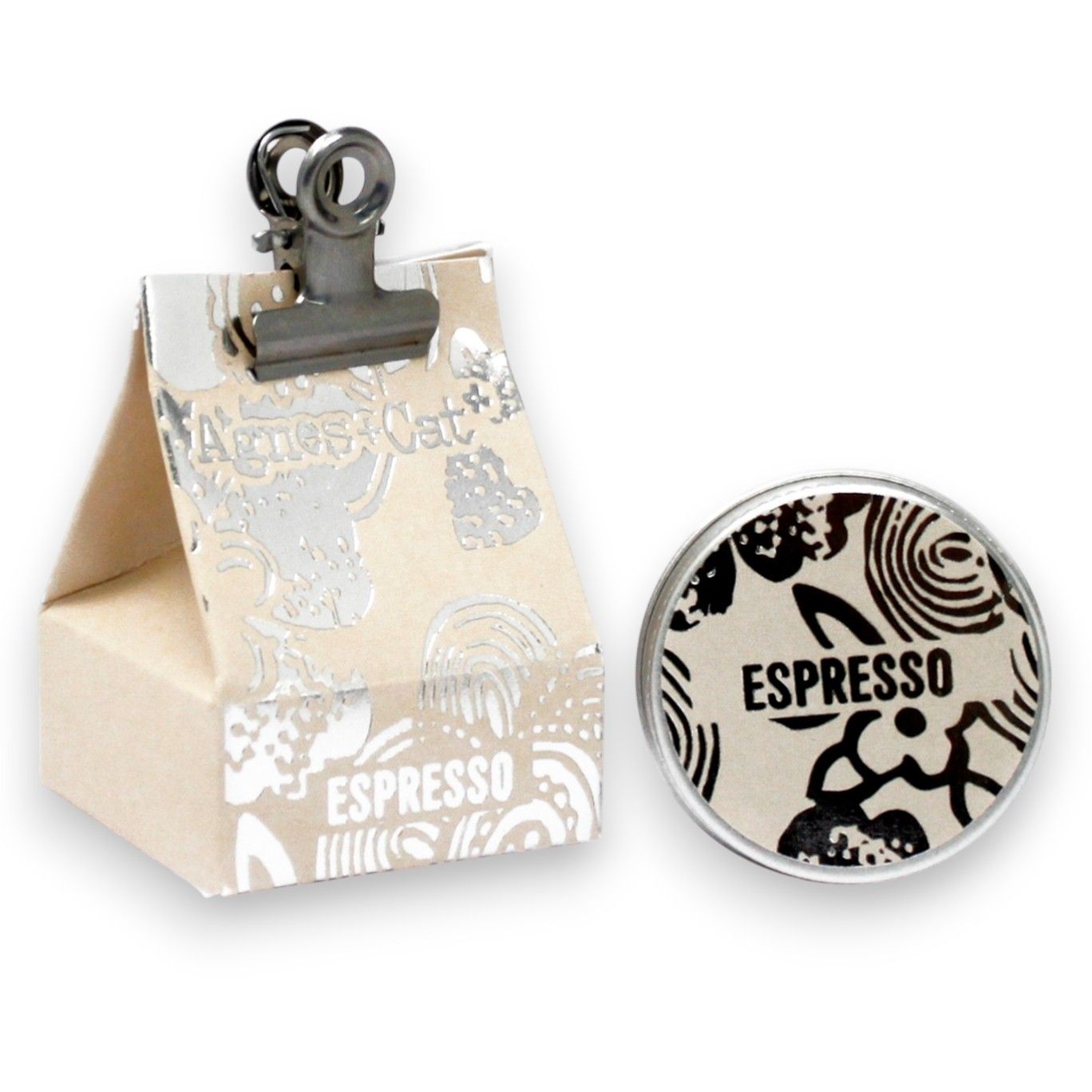 A 20g round tin of Espresso Martini scented lip balm with a stylish black and gold coffee-themed gift box.