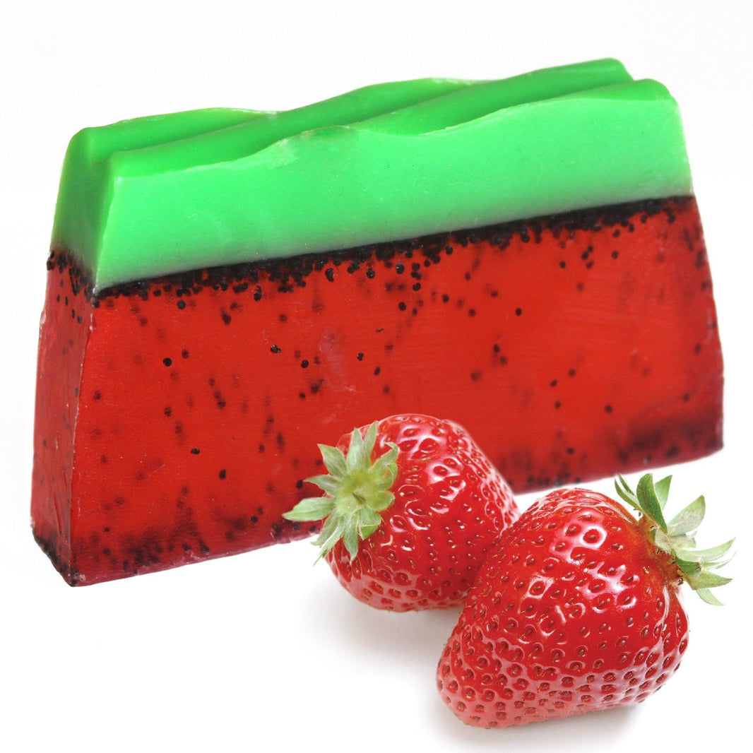 A 115g artisan olive oil soap slice with vibrant red and green layers designed to look like a tropical strawberry paradise.