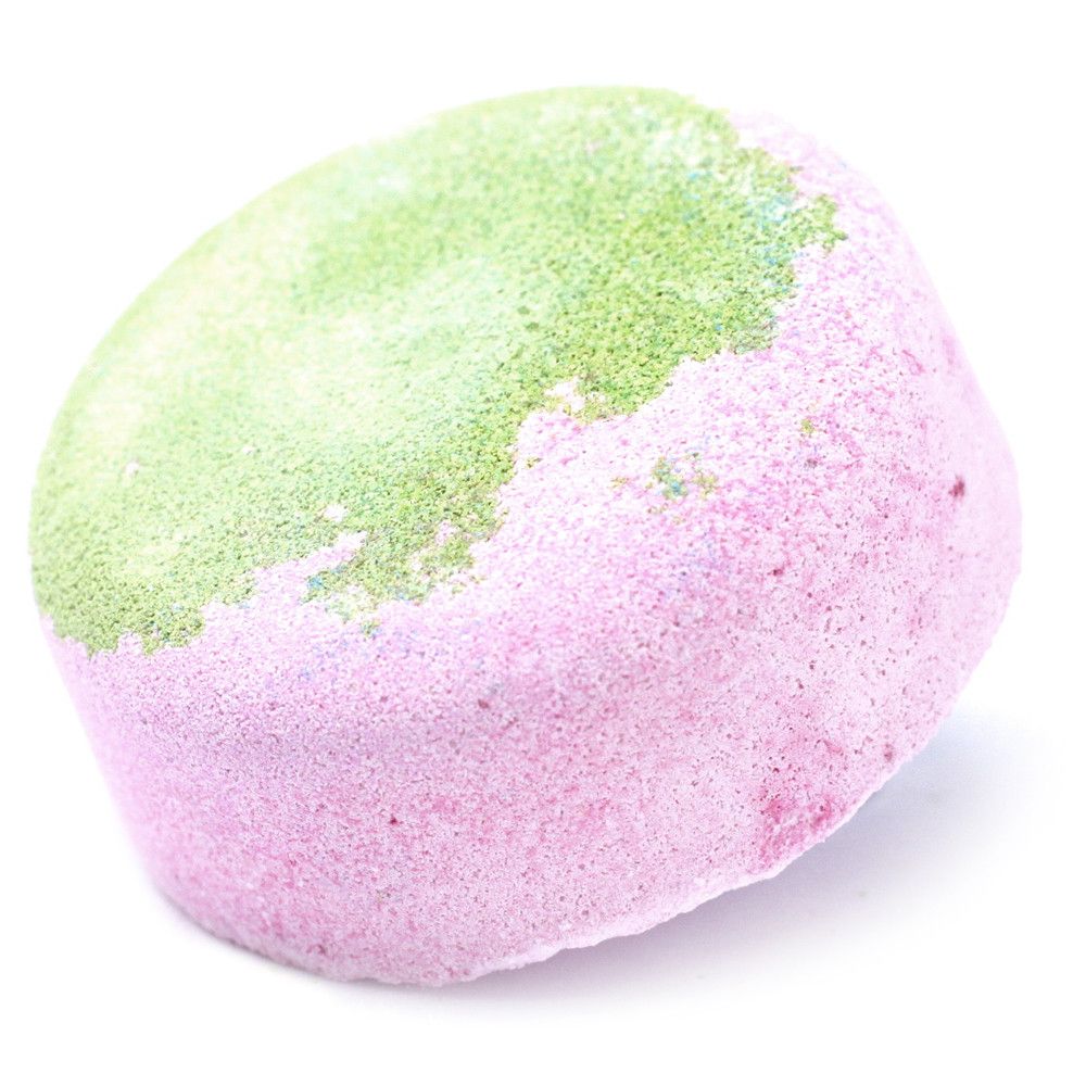 A large round bath bomb featuring a vibrant pink and green marble effect with a tropical guava scent.