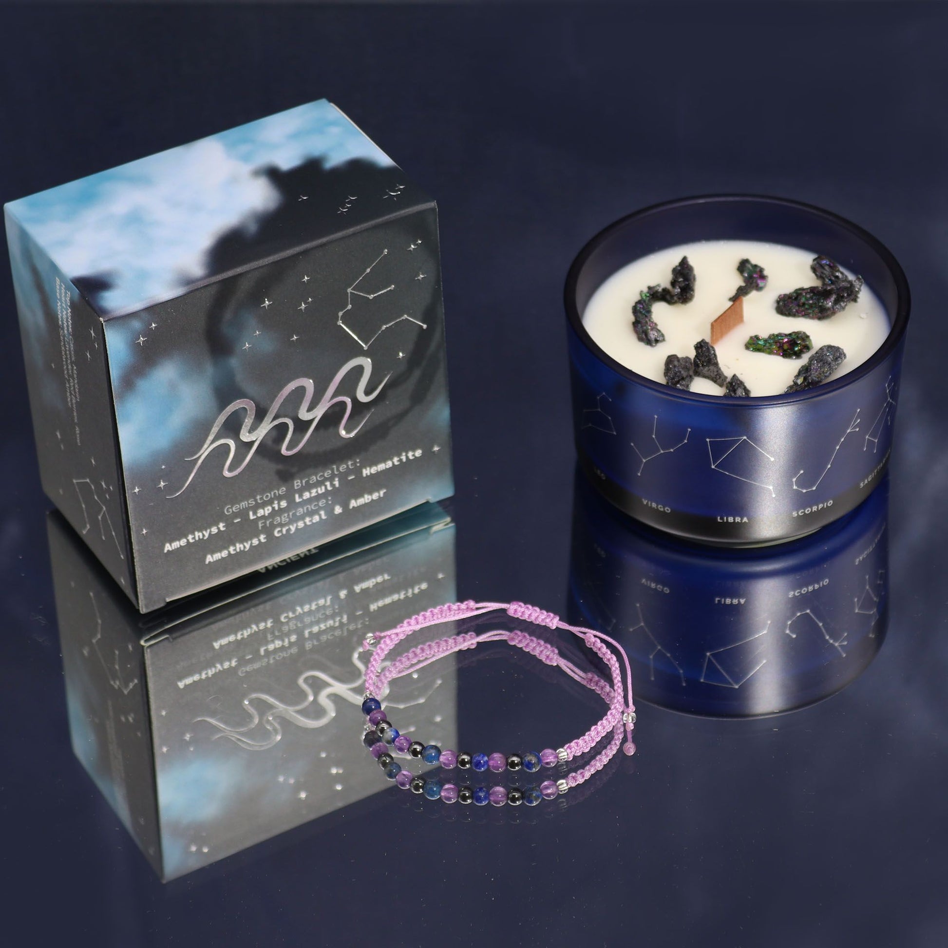 A luxury black candle tin with gold Aquarius constellation artwork, displayed with a surprise semi-precious stone bracelet reveal.