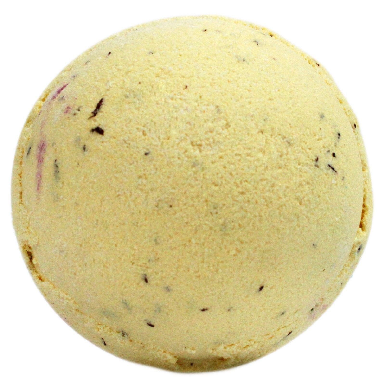A large, round yellow bath bomb with brown speckles, mimicking the look of a classic banoffee pie dessert.