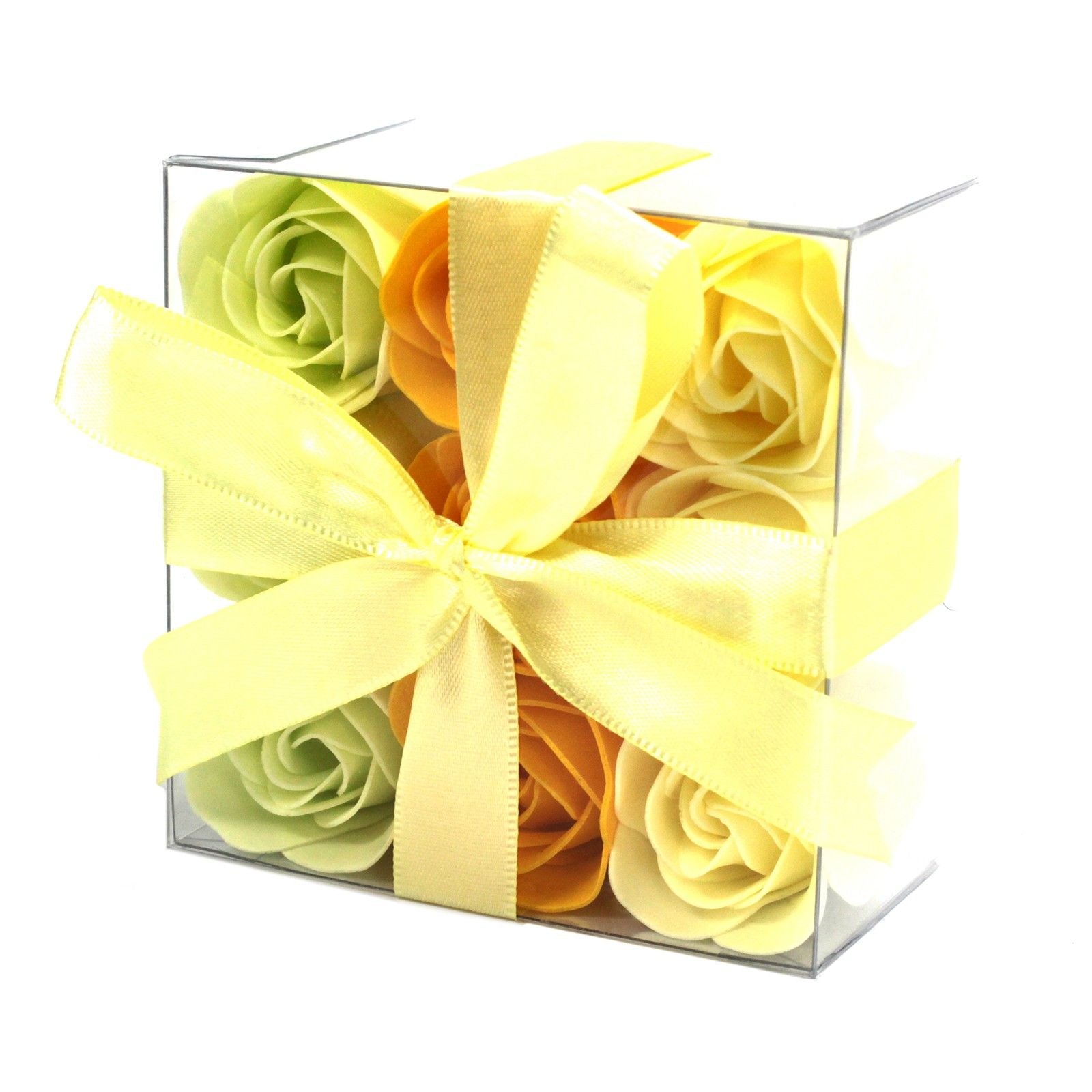 A square gift box containing nine realistic soap roses in yellow and cream spring shades.