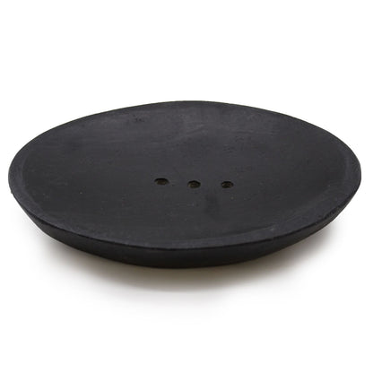 A sleek, oval-shaped soap dish carved from solid black natural marble with subtle, elegant stone veining.
