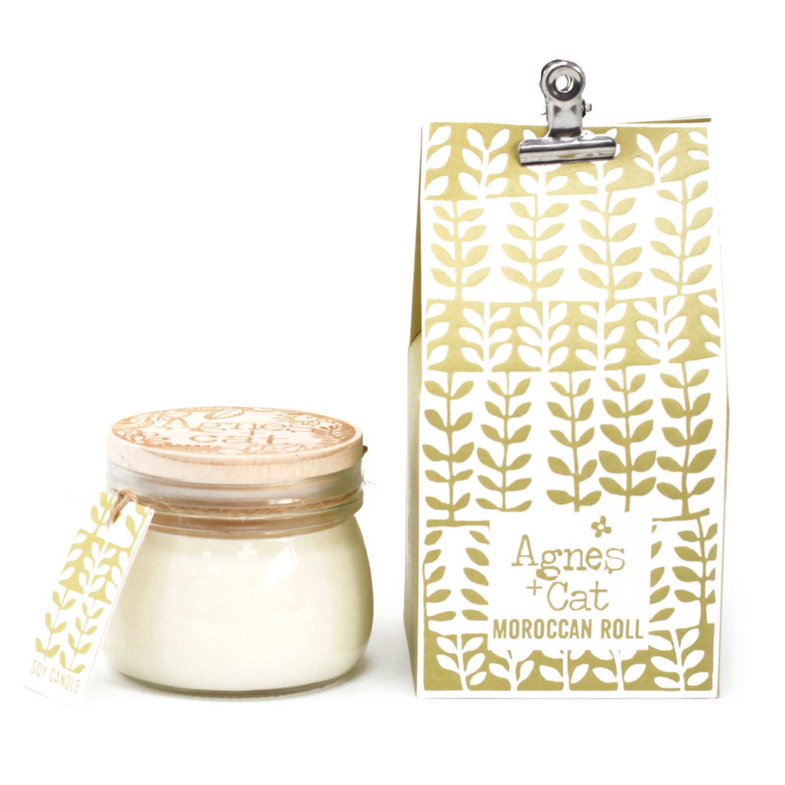 A glass Kilner jar candle with an intricate gold and black Moroccan-inspired label and a functional wire-clip lid.
