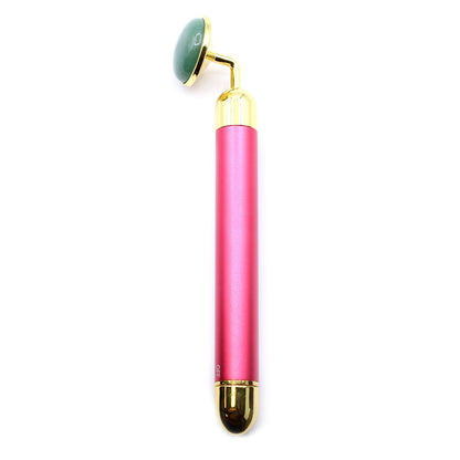A polished green jade gemstone tool designed as a vibrating facial pad for skincare rituals.