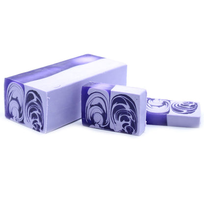 A massive 1.2kg purple and white marbled handcrafted soap loaf featuring a fragrant, spring-inspired lilac scent.