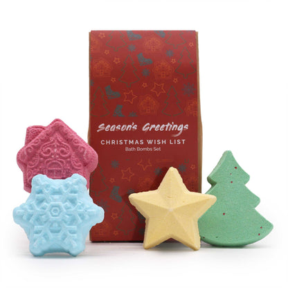 A festive holiday gift box containing five assorted star and tree-shaped bath bombs in vibrant blue, red, and green colors.