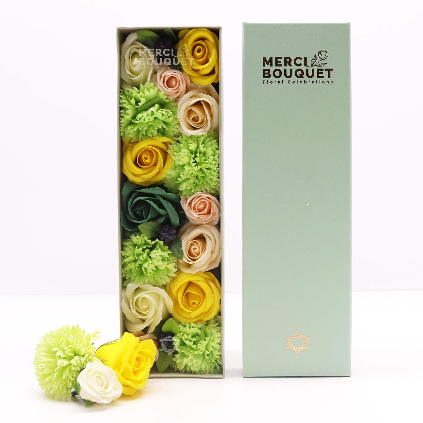 A long, rectangular gift box showcasing a beautiful arrangement of yellow and green soap flower blooms and foliage.