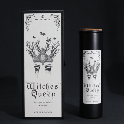 A tall, slim black pillar candle elegantly boxed in a dark, occult-inspired cardboard sleeve with silver foil details.