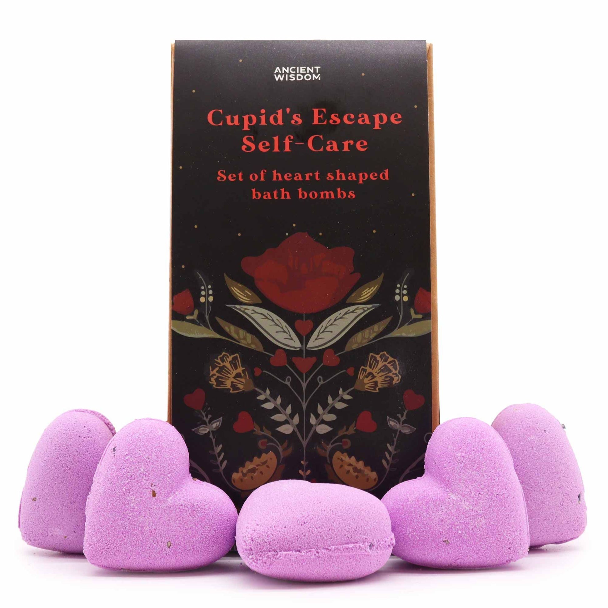 A gift box containing multiple pink and red heart-shaped bath bombs, branded as Cupid's Escape Self Care.
