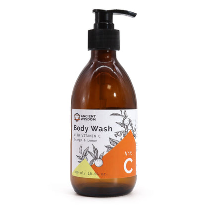 A professional 250ml amber glass pump bottle of aromatherapy body wash featuring a bright orange and lemon citrus label.