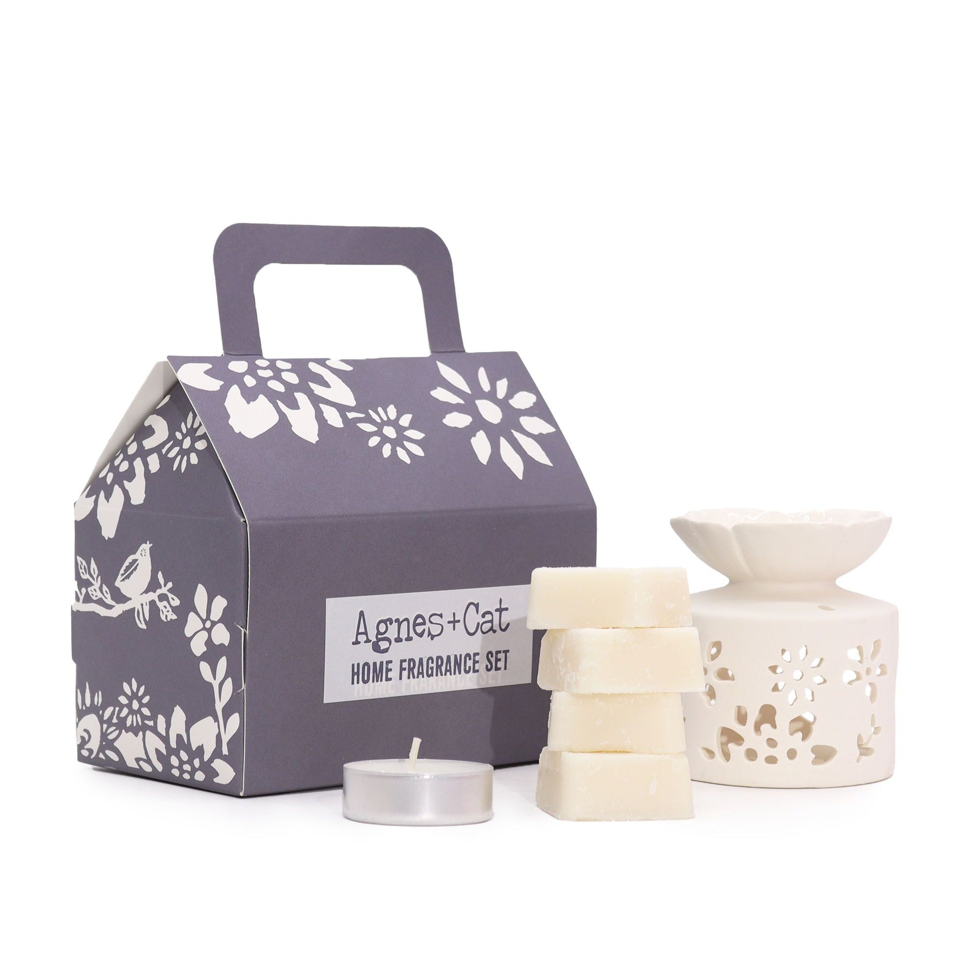 A decorative grey-toned gift box containing a variety of Windemere scented luxury bath products and matching candles.