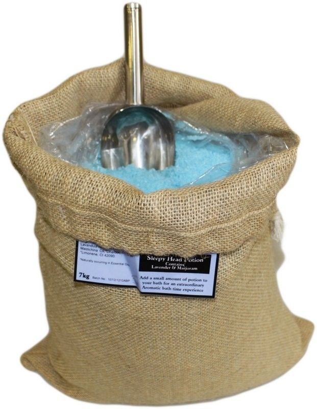 A massive 7kg rustic hessian sack of Sleepy Head Potion bath salts with a natural tan label and wooden scoop.