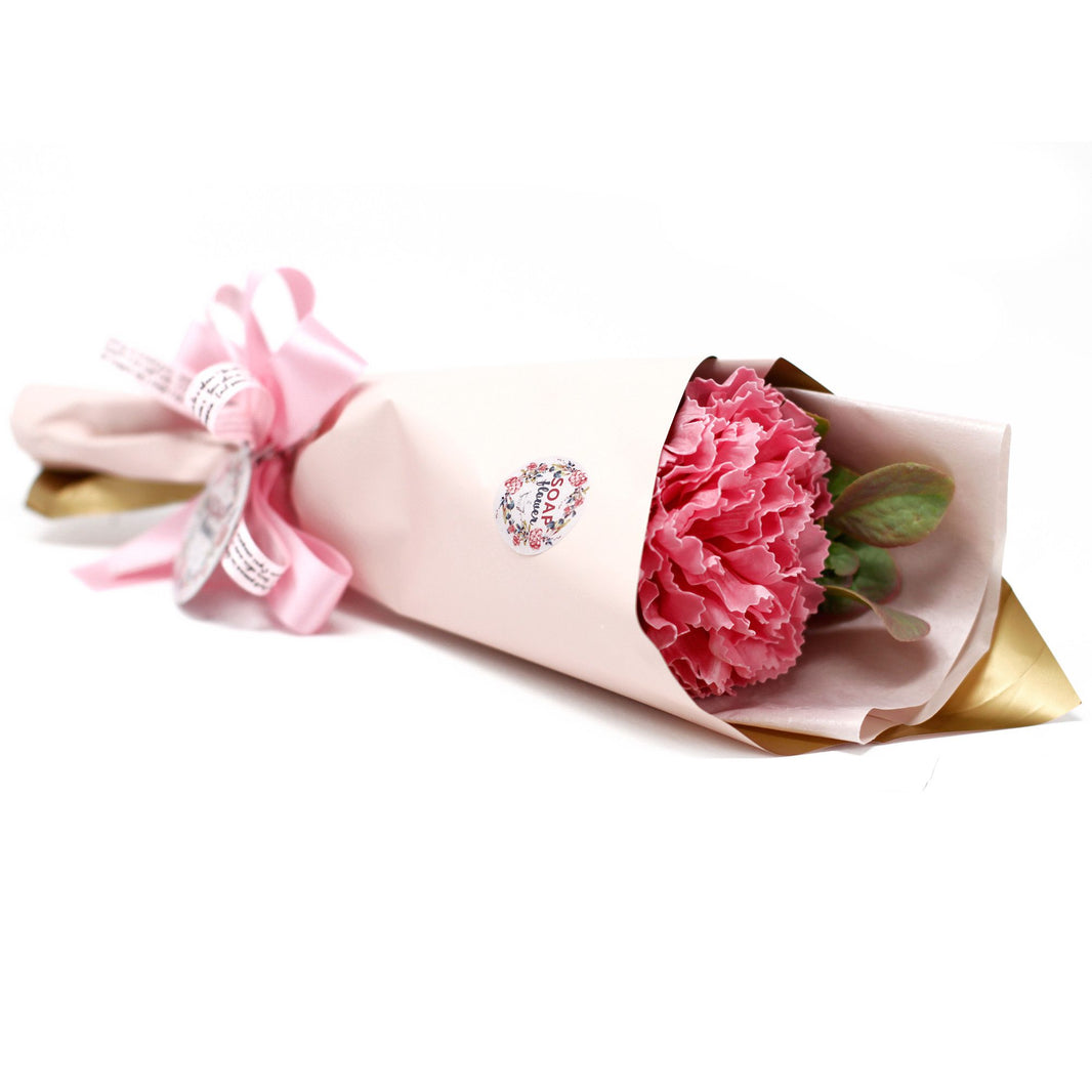 A large, elegant bouquet of pink and cream soap carnations in a decorative gift box with a pink bow.