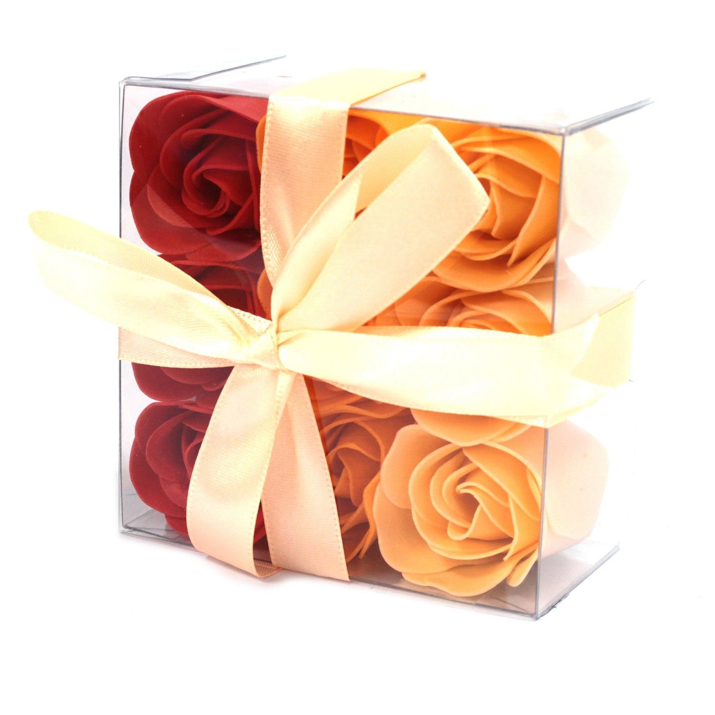 A square gift box filled with nine realistic peach-colored soap rose flowers arranged beautifully.