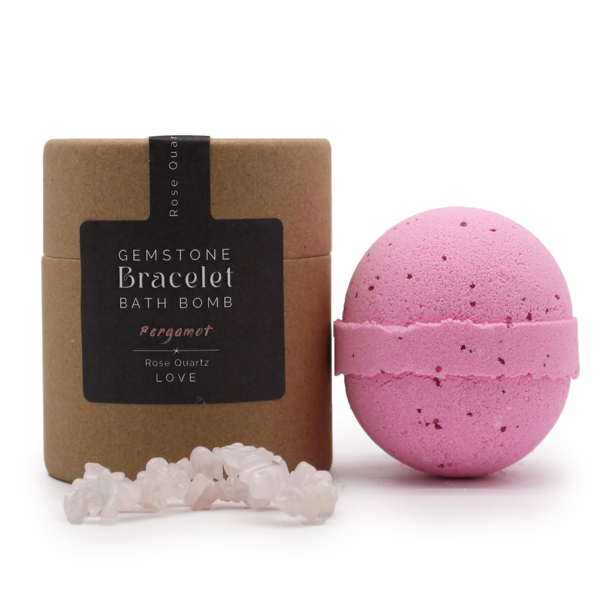 A 170g pink and white bath bomb with a genuine Rose Quartz gemstone bracelet shown as the hidden surprise gift inside.