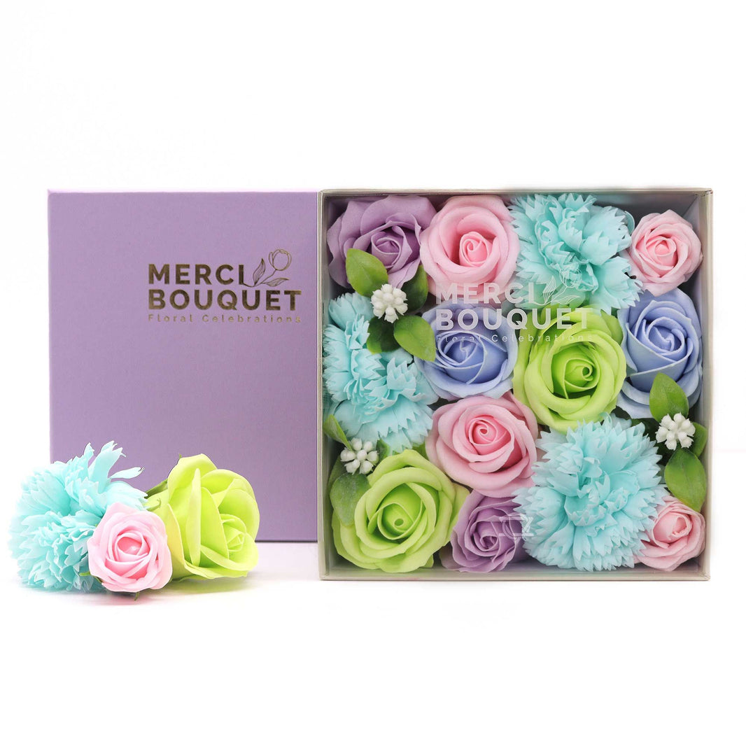 A blue square gift box filled with realistic blue and white soap flowers, ideal for baby showers and new arrivals.
