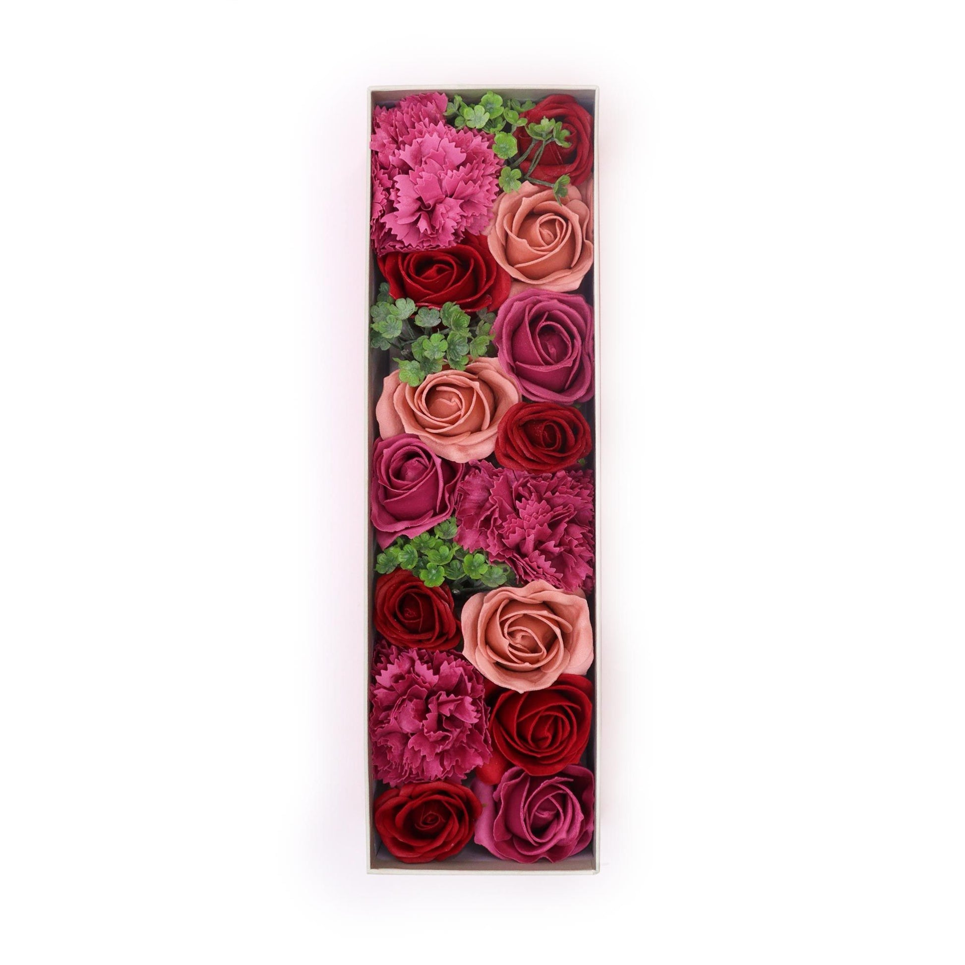 A luxury red long gift box filled with realistic antique-style pink and mauve soap roses arranged in a decorative display.