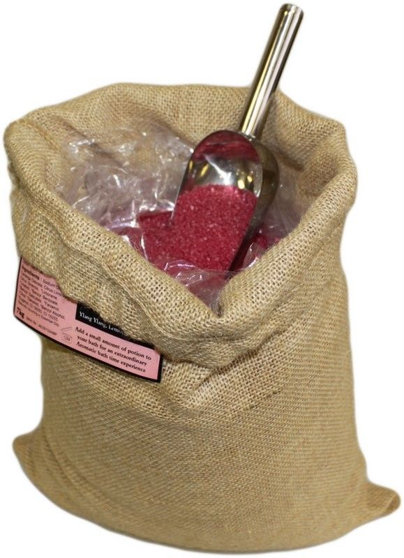 A large 7kg rustic hessian sack filled with Passion Potion bath salts, featuring a traditional wooden scoop.