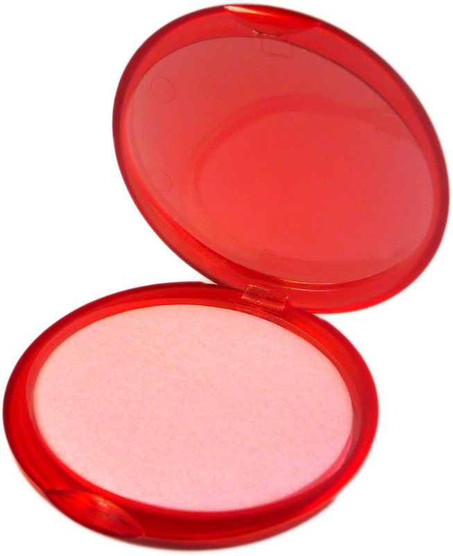 A round red travel case containing thin, strawberry-scented paper soap sheets for portable hygiene.