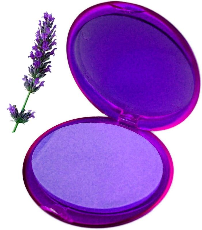 A round purple travel-friendly container holding delicate lavender-scented paper soap petals.