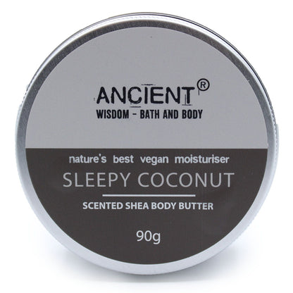 A 90g jar of white shea body butter featuring a calming coconut fragrance and a premium black and silver label.