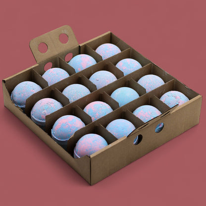 A wooden display crate holding sixteen large, marbled blue and white baby powder scented bath bombs.