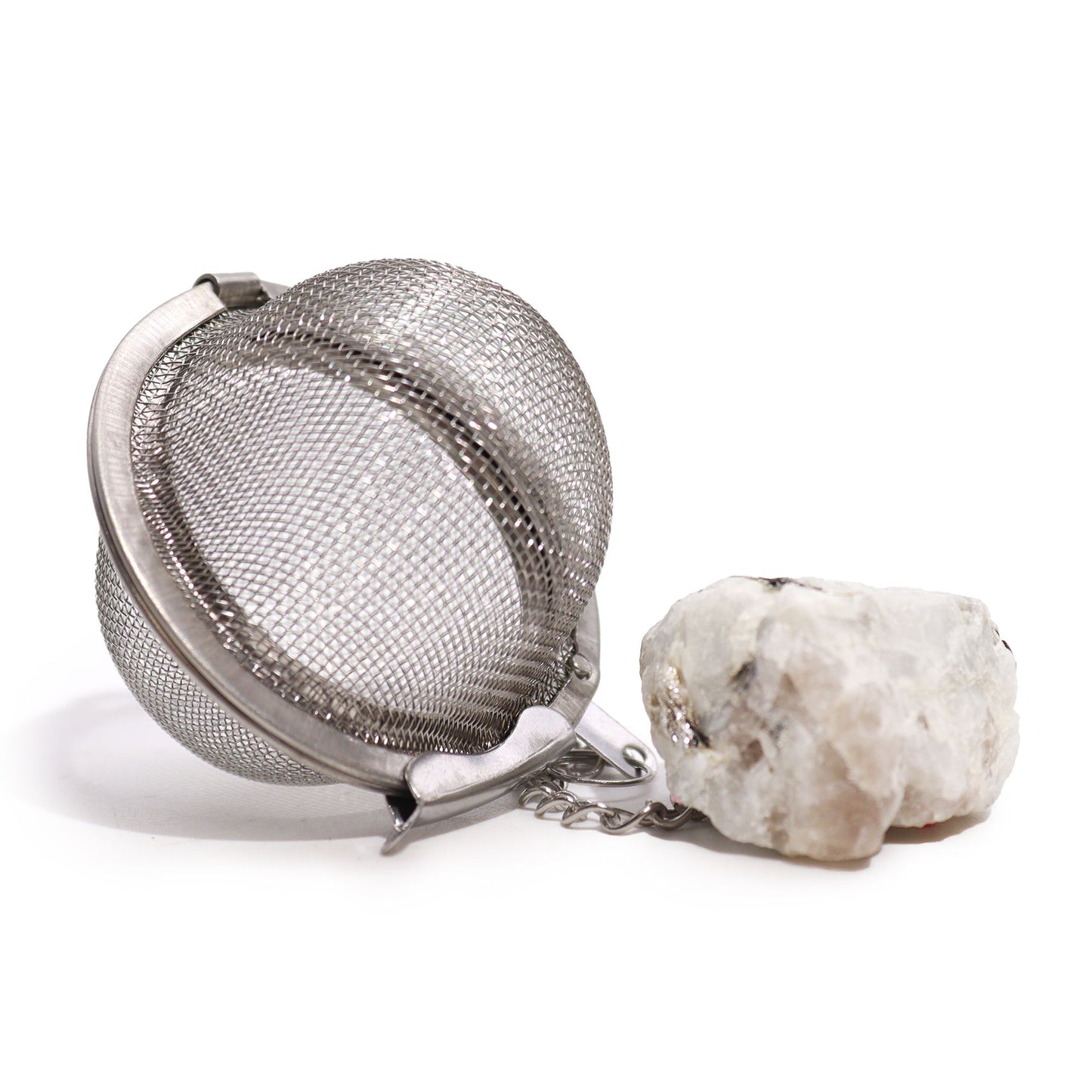 Stainless steel tea infuser ball with a raw rainbow moonstone crystal hanging from a silver chain.