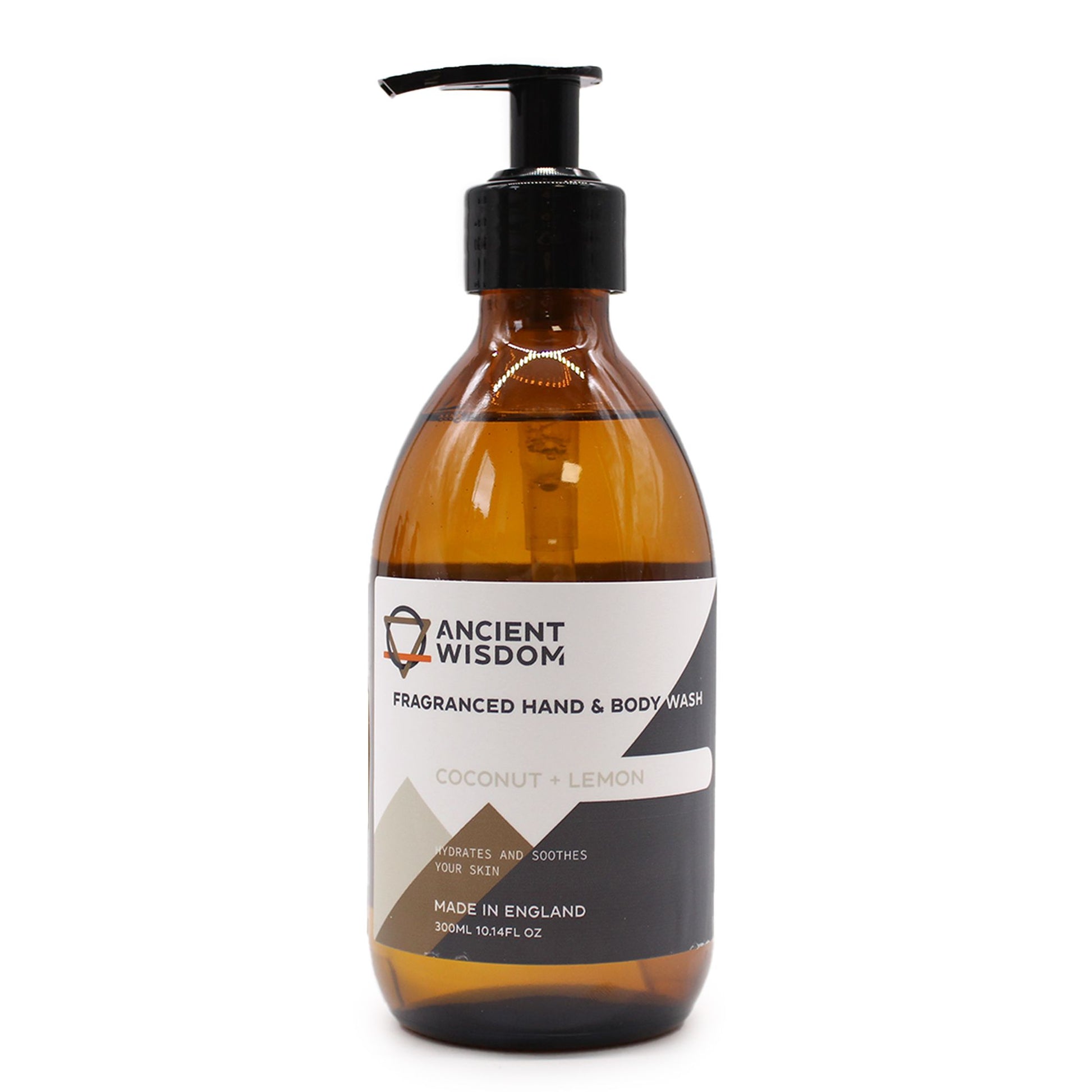 A premium amber glass dispenser bottle with a professional pump top, containing luxury coconut and lemon liquid wash.
