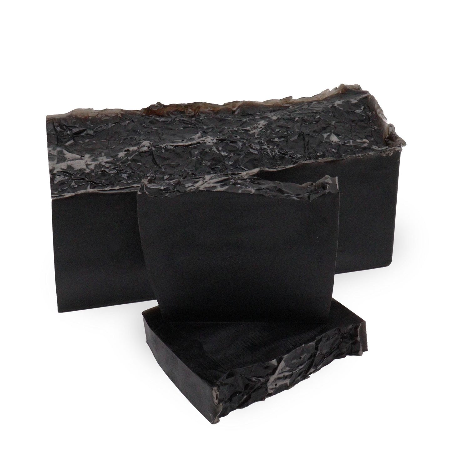 A sleek black artisan soap slice with a modern, minimalist design and a sophisticated, deep fragrance.