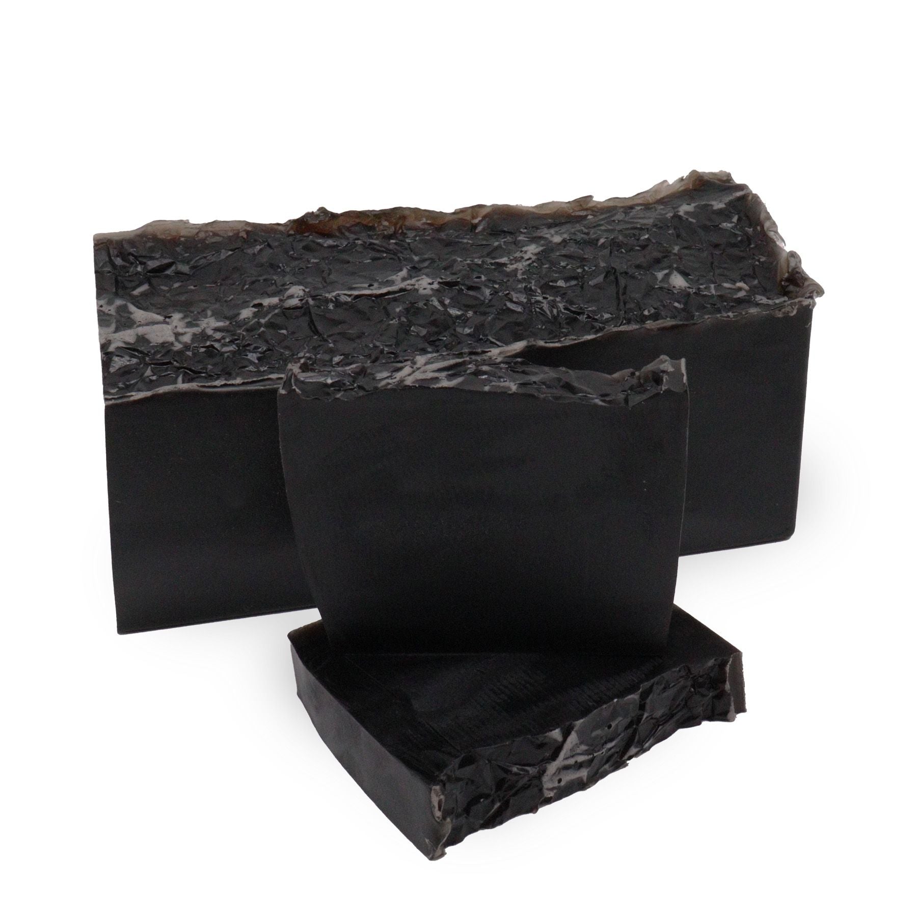 A sleek black artisan soap slice with a modern, minimalist design and a sophisticated, deep fragrance.