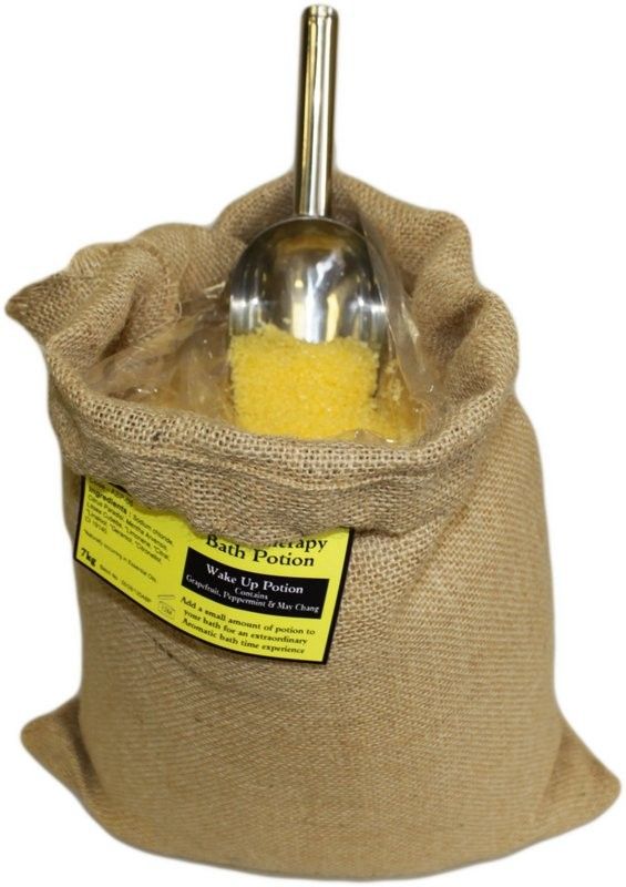 A large 7kg yellow-labeled hessian sack of Wake Up Potion bath salts for an invigorating and bulk aromatherapy experience.
