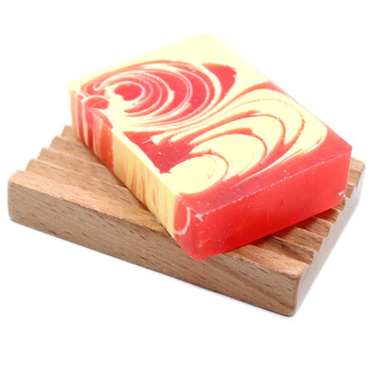 A 115g artisan soap slice featuring vibrant red swirls and a sweet, nostalgic strawberry fragrance.