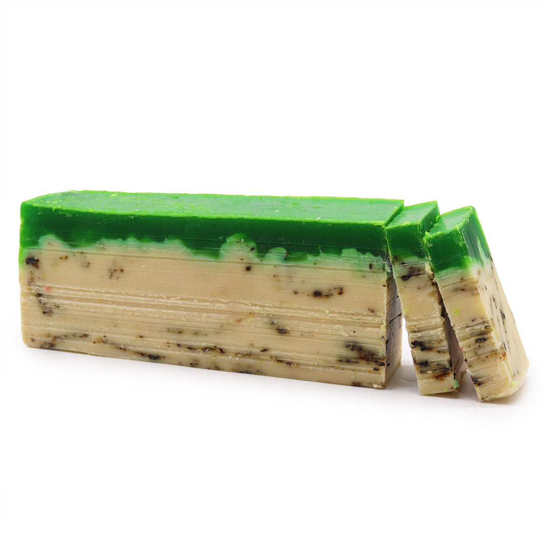A 100g artisan soap slice featuring a dark green top layer and a creamy olive oil base, infused with green tea extracts.