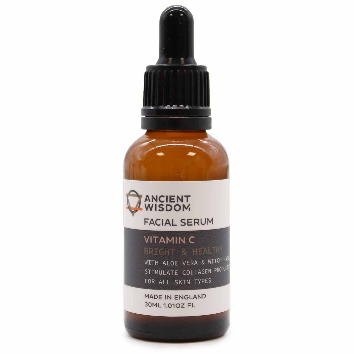 An amber glass bottle of Vitamin C face serum with a professional black dropper top and an apothecary-style label.