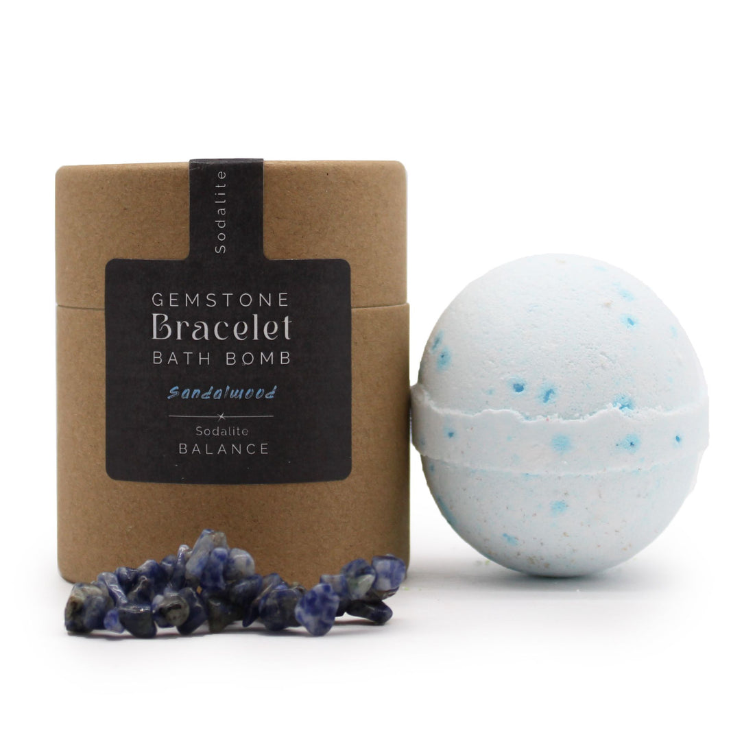 A blue and white 170g bath bomb with a genuine Sodalite gemstone bracelet shown as the hidden gift inside.