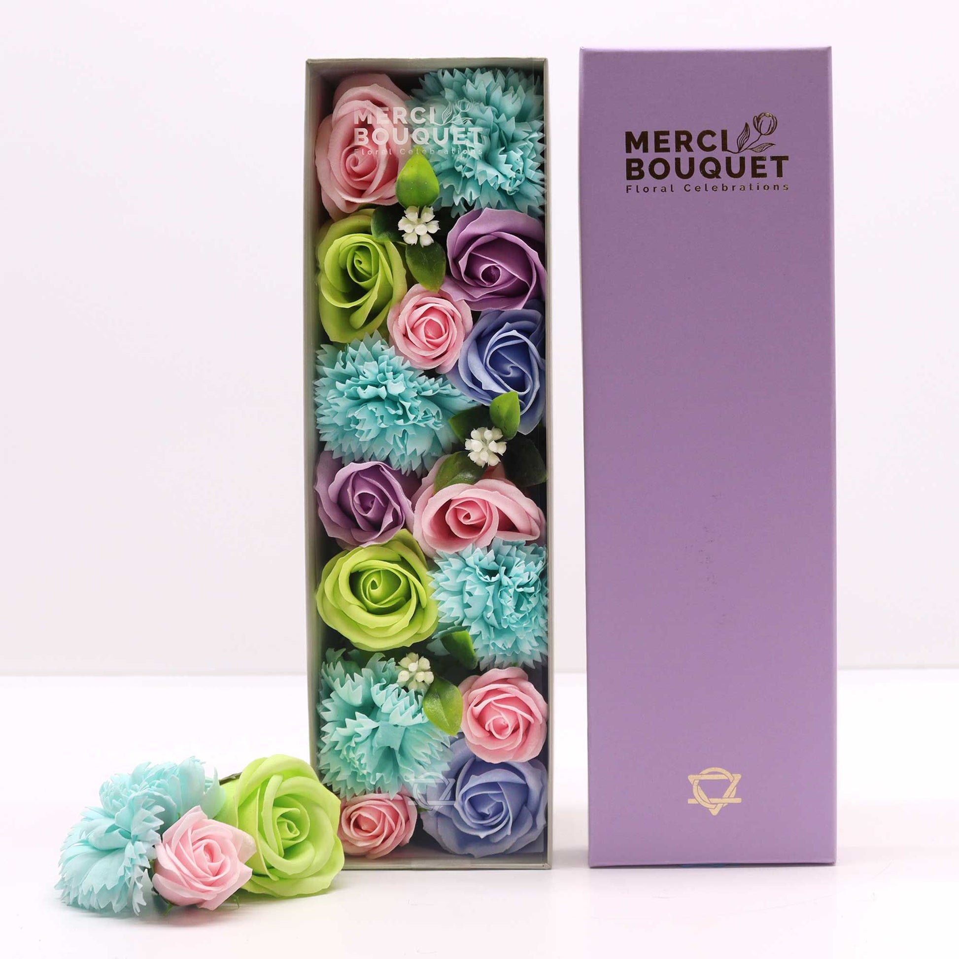 An elegant long gift box filled with realistic blue and white soap roses and carnations, perfect for a baby shower gift.
