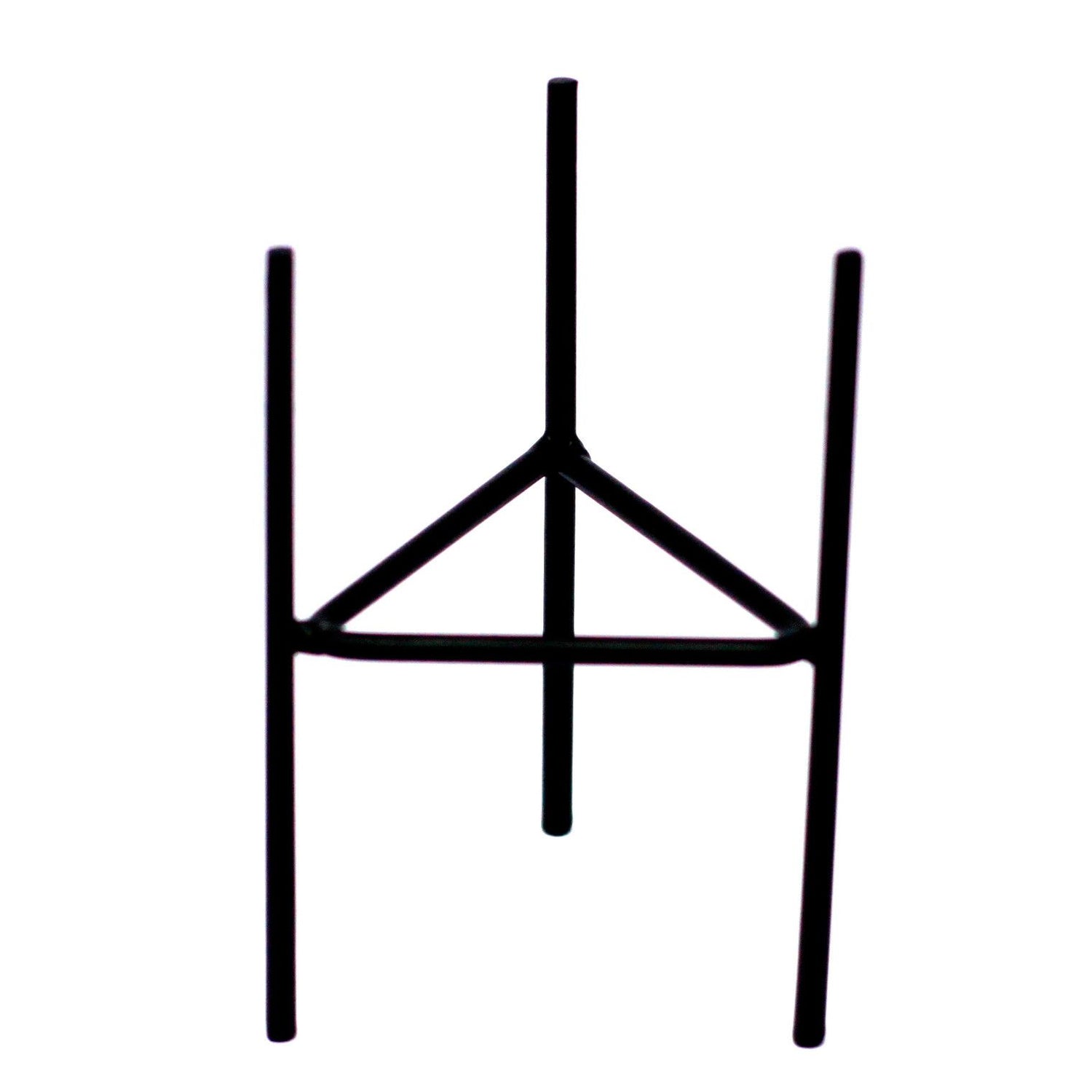 A black metal iron candle holder with a minimalist geometric design, perfect for holding botanical glass candles.
