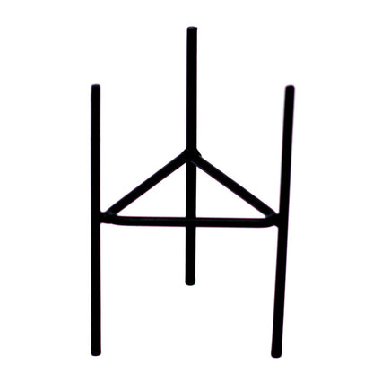A black metal iron candle holder with a minimalist geometric design, perfect for holding botanical glass candles.