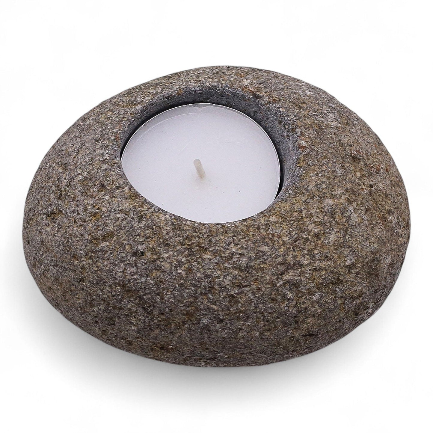 A smooth, naturally rounded grey riverstone with a single circular cutout for a tea light candle.