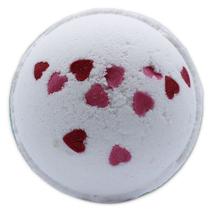 A large 180g white bath bomb decorated with pink and red dried wildflower petals.