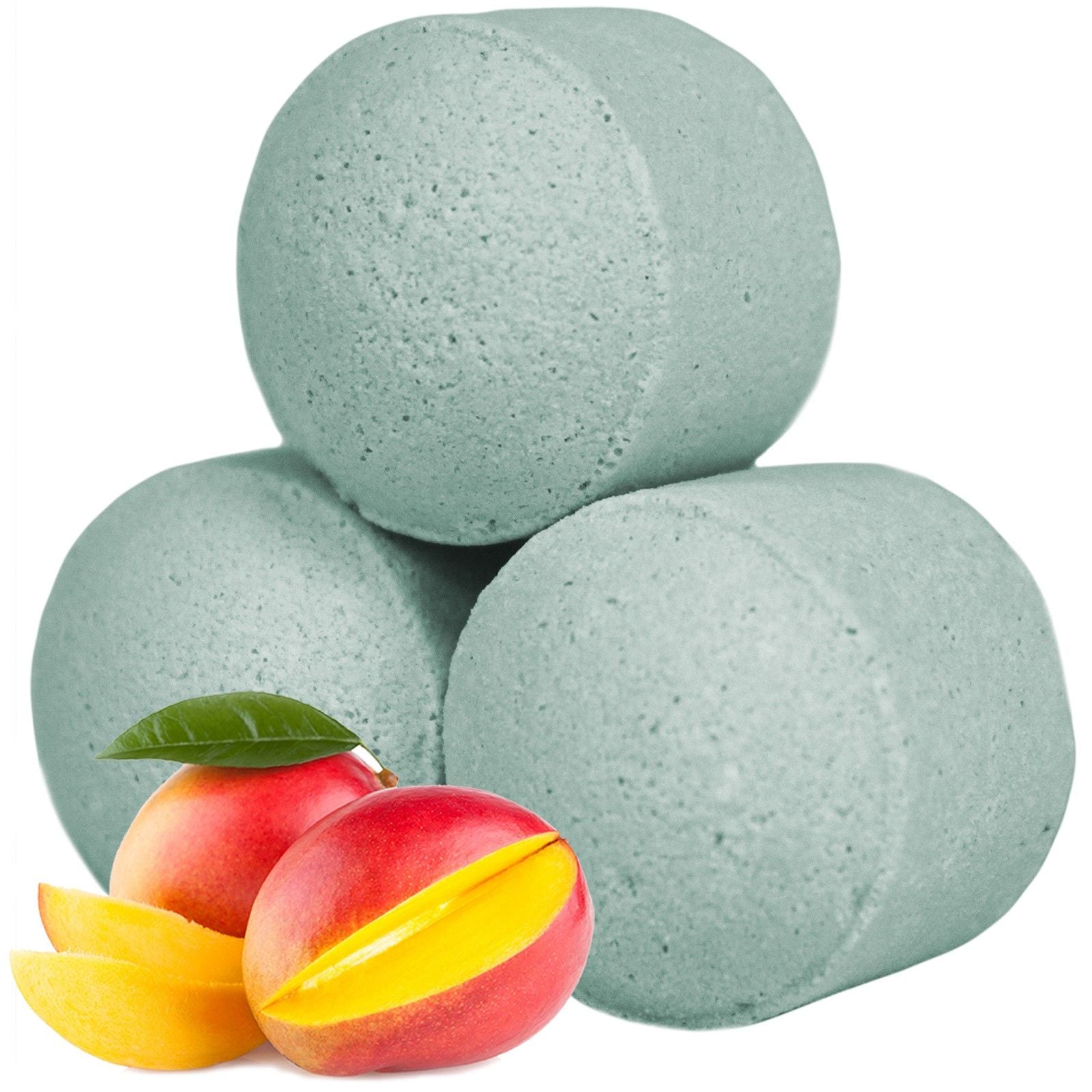 A large bulk collection of light green mango-scented mini bath bombs displayed with fresh tropical fruit accents.