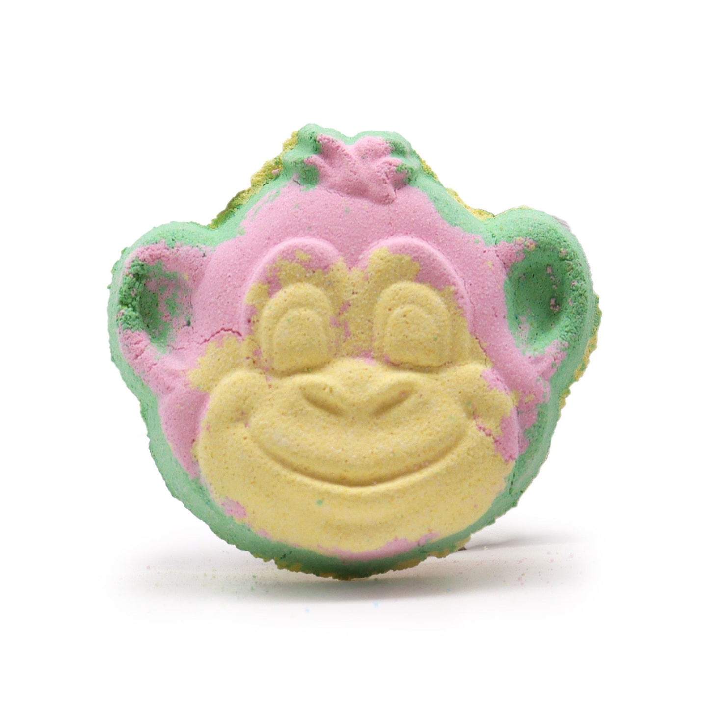 A fun, monkey-faced bath bomb in shades of green and pink, featuring a sweet guava and strawberry fragrance.