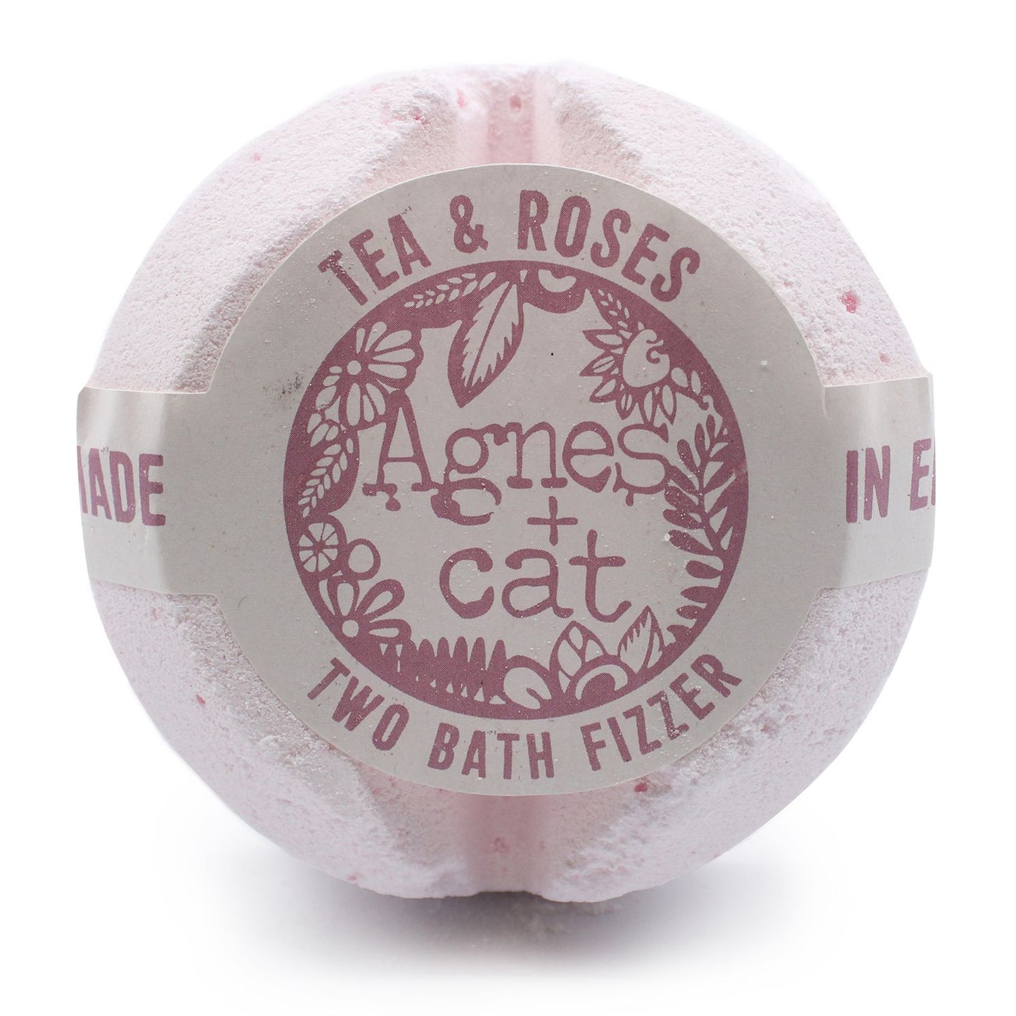 A jumbo 200g bath fizzer with a pale pink label showcasing elegant rose and tea leaf designs.