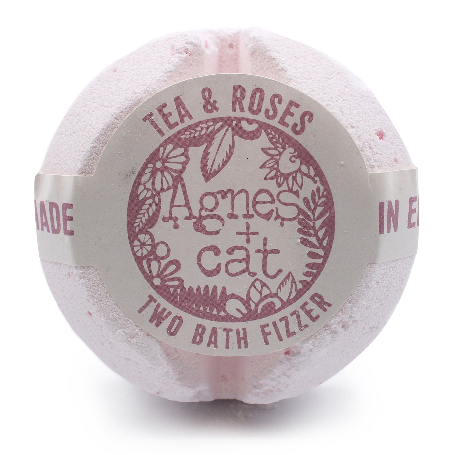 A jumbo 200g bath fizzer with a pale pink label showcasing elegant rose and tea leaf designs.
