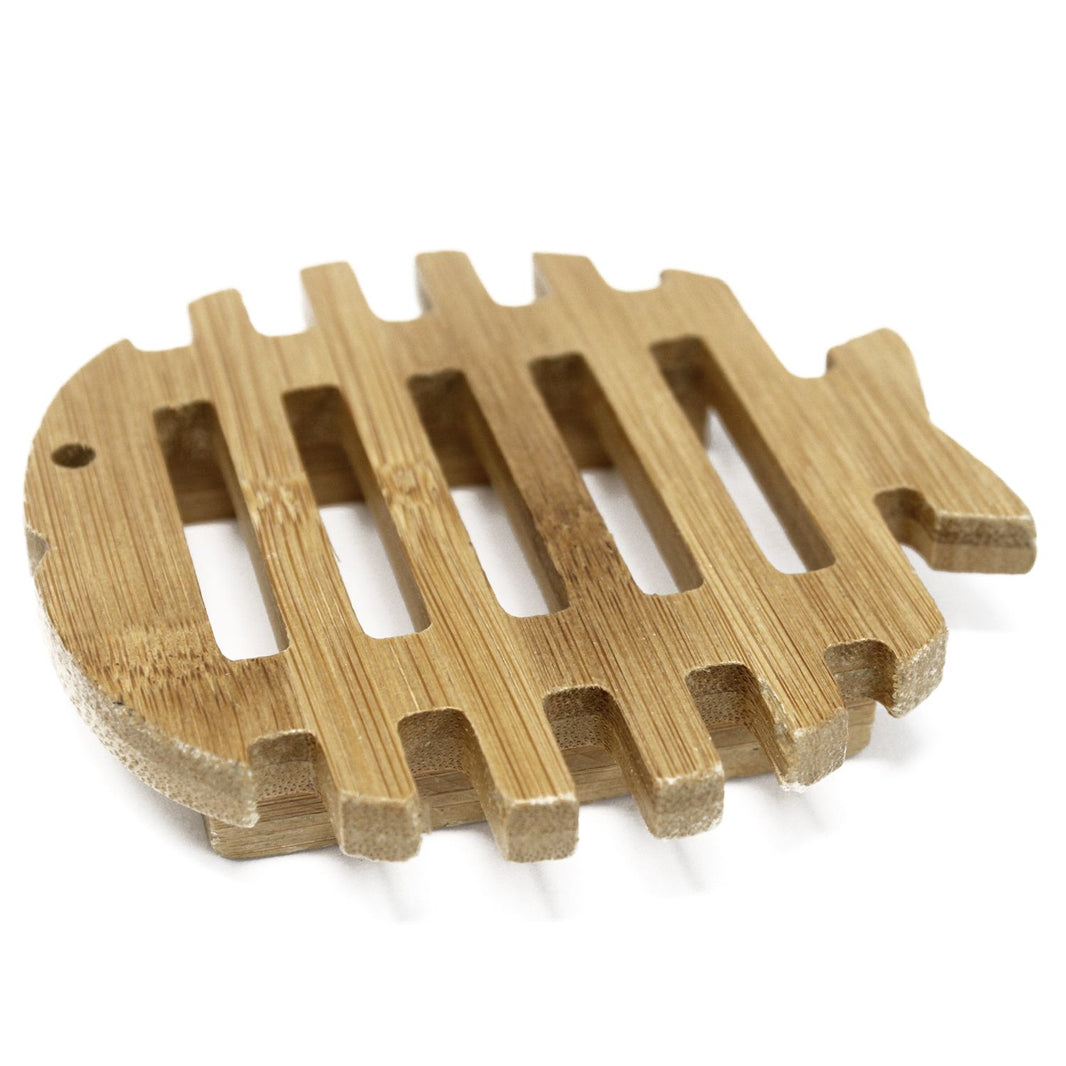 A fun and functional Hemu wood soap dish hand-carved into a fish shape with drainage slots.