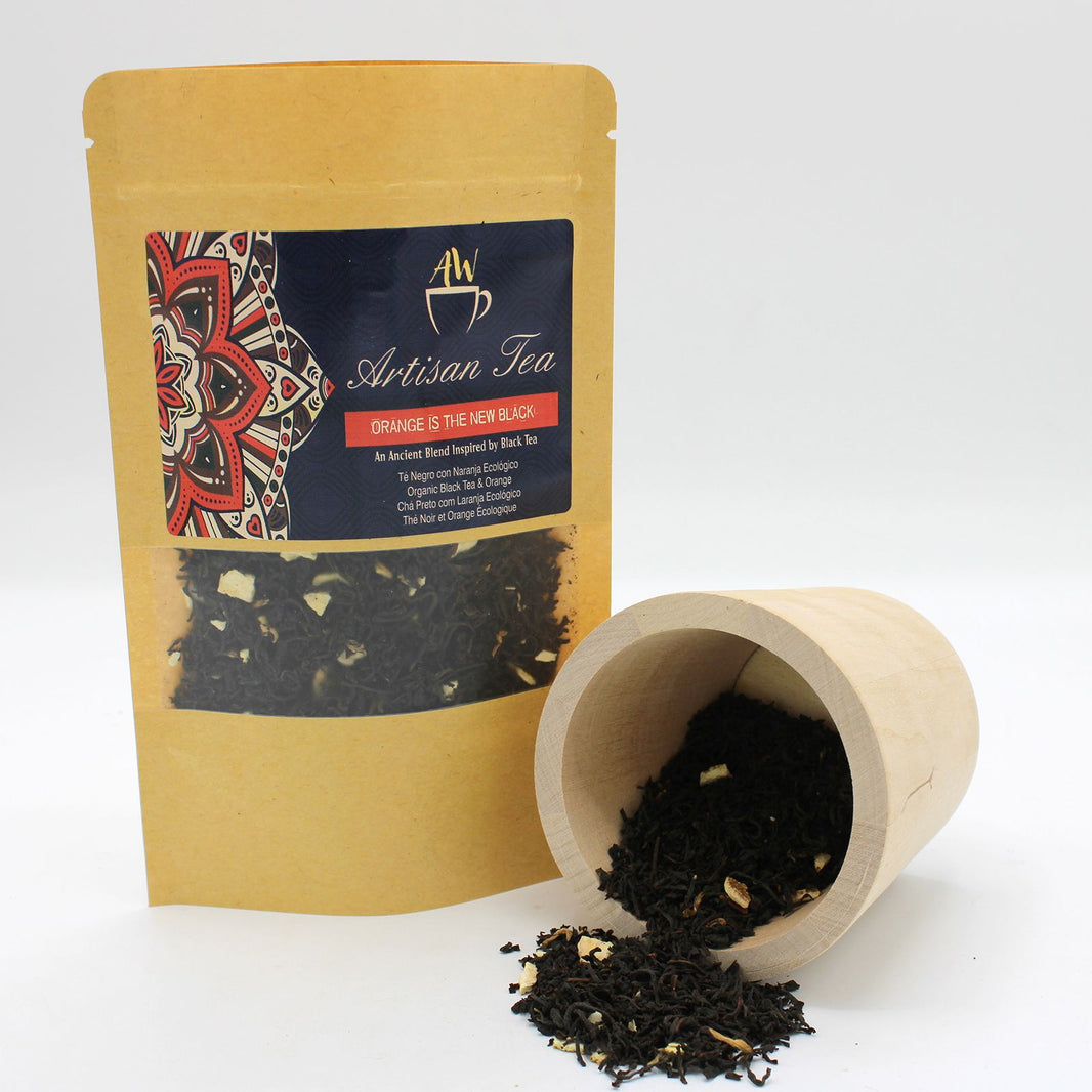 A sustainable cardboard tea tube featuring organic orange-scented black tea leaves.