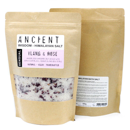 A 500g kraft paper bag of pink Himalayan salts mixed with dark botanical petals and romantic essential oils.